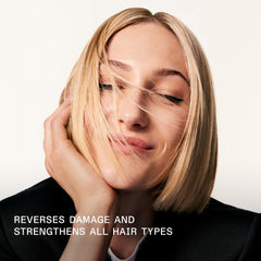 Applying Olaplex No.3 to damp hair demonstrating targeted pre-shampoo repair benefits
