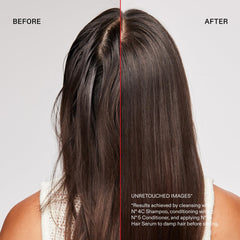 Olaplex shampoo being applied to wet hair to remove hard water and product residues effectively