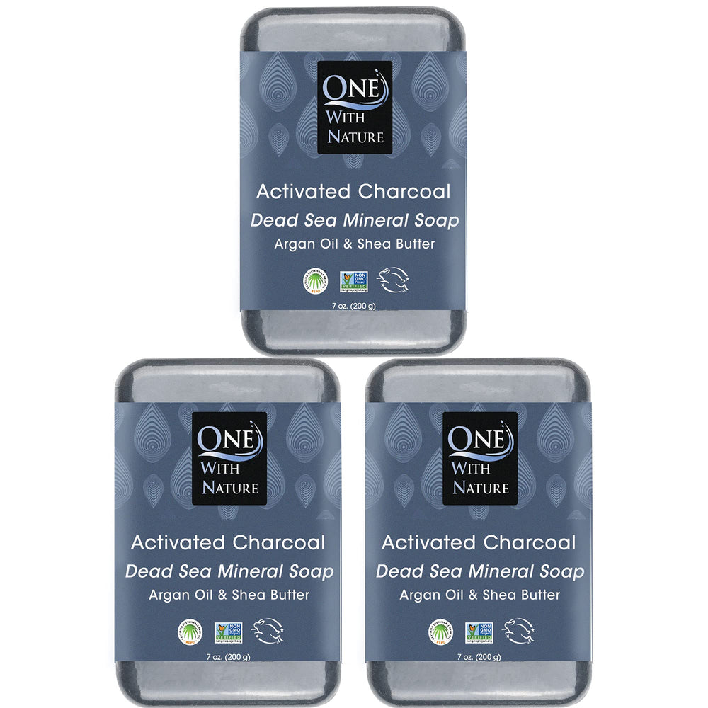 One With Nature Activated Charcoal Soap bar close-up showing detoxifying action for clearer skin.