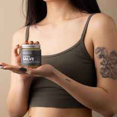 Ora's Amazing Herbal Tattoo Salve texture closeup highlights balm-like, light finish.