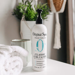 Original Sprout Curl Calmer bottle pour demonstrates easy application for smooth curls