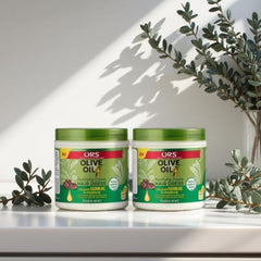 ORS Olive Oil Fortifying Cream Hair Dress being applied to hair for smooth finish