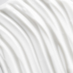 Osea advanced-protection-face-cream-application-on-cheek suggests daily moisturizing for comfort.