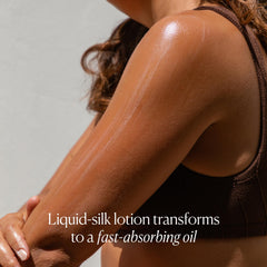 OSEA coconut oil texture on fingers suggesting smooth, velvety skin after application.