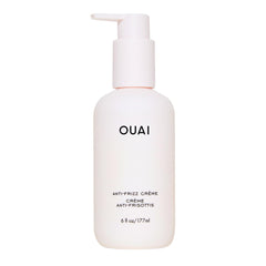 OUAI Anti Frizz Cream bottle pour demonstrates controlled application and frizz control