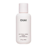 OUAI Anti Frizz Cream travel-size packaging for on-the-go frizz control.