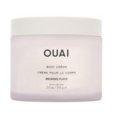 OUAI Melrose Place Body Cream bottle pouring for easy application and hydration.