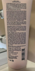 OUAI Curl Cream on wet strands delivers wash-and-go definition and shine.