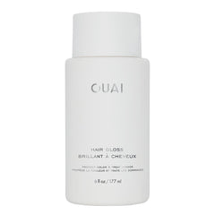 OUAI Hair Gloss bottle close-up showing in-shower shine-boosting treatment.