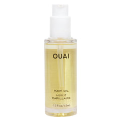 OUAI Hair Oil bottle with gloss finish promotes smooth, shiny hair.
