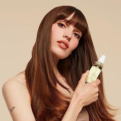 OUAI Hair Oil showcases frizz-control effect for humid days.