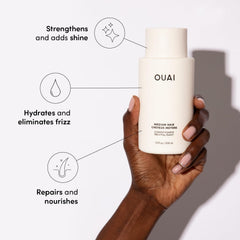 OUAI Medium Conditioner on wet hair for detangling and smoothness.
