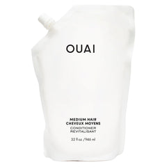 OUAI medium conditioner refill bottle pour shows weightless hydration for dry hair.