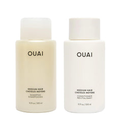 OUAI Medium Shampoo bottle pour showing cleansing action for smoother hair