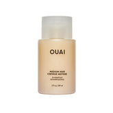 OUAI Medium Shampoo Travel Size bottle front view, a compact travel-friendly packaging.