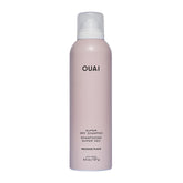 OUAI Super Dry Shampoo spray can at distance demonstrates oil absorption from roots