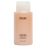 OUAI Thick Shampoo bottle close-up highlighting hydration and frizz control.
