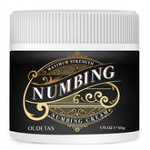 Oudetas numbing cream tube closeup—fragrance-free for sensitive skin use.