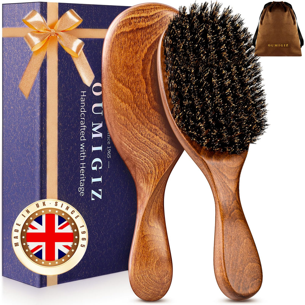 OUMIGIZ boar bristle brush close-up shows premium natural bristles for smooth detangling.