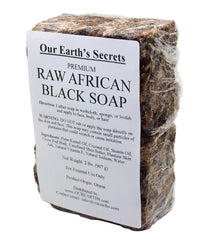 Our Earth's Secrets raw African black soap bar for natural cleansing and nourishment.