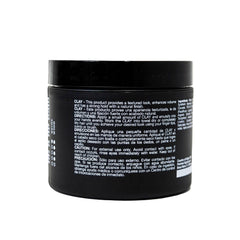Pacinos Signature Line clay hair paste hands applying demonstrates firm hold and textured style.