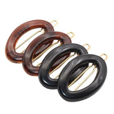 Parcelona eggie oval shell mini-barrette close-up, ideal for fine hair using luxe acetate.