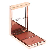 Patrick Ta Major Headlines Duo in Bright Pinky Coral delivers a radiant everyday blush glow.