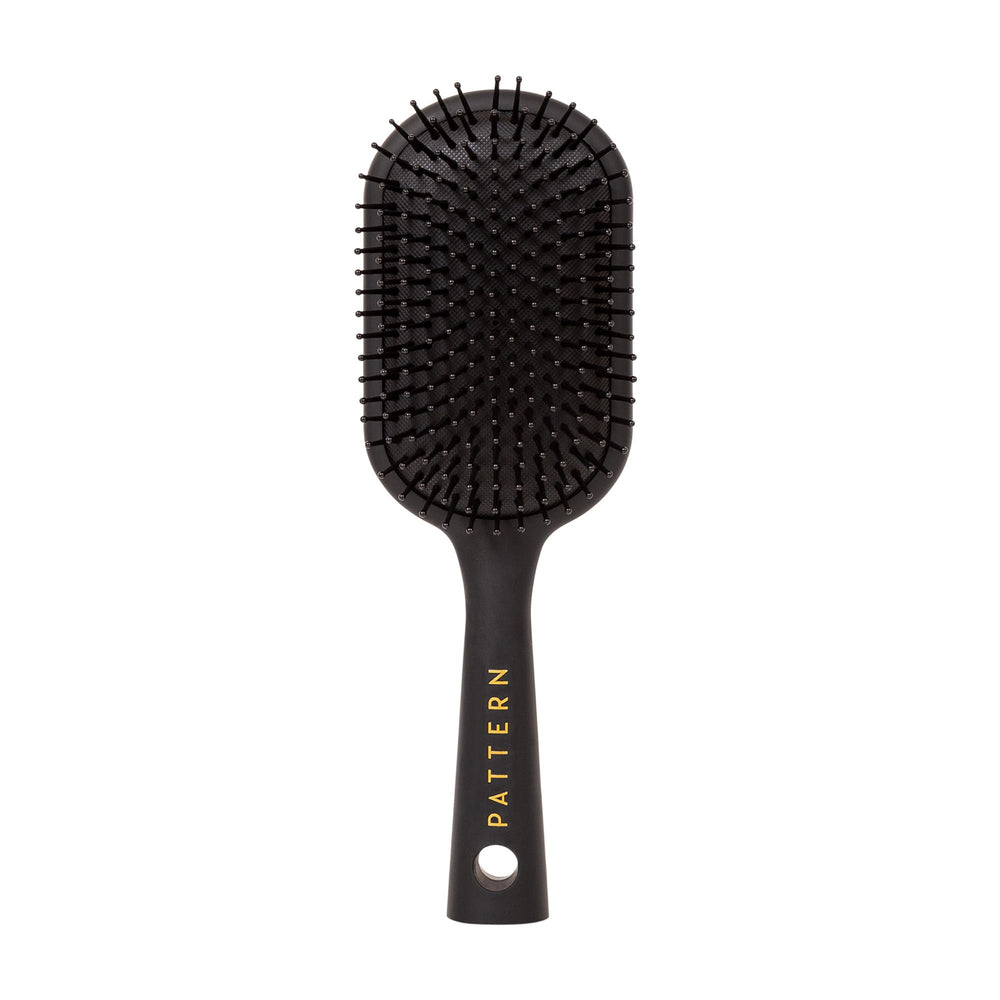 PATTERN Beauty paddle brush heat-resistant bristles for smoother detangling and styling.