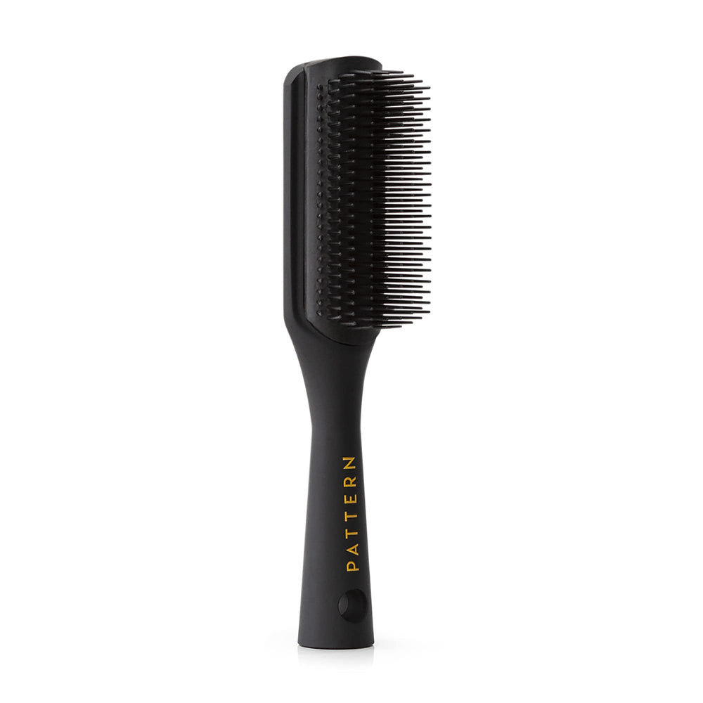 PATTERN Beauty Shower Brush full view shows ergonomic handle for gentle detangling.