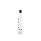 Paul Mitchell Freeze and Shine bottle pour shows controlled spray for lasting hold and shine.