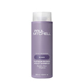 Paul Mitchell Platinum Blonde Violet Shampoo bottle shows color-enhancing formula for brassy tones.