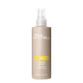 Paul Mitchell Taming Spray bottle shows gentle detangling for kids' hair.