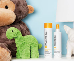 Paul Mitchell Taming Spray on kid's hair supports easy application and comb-through.