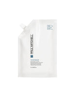 Paul Mitchell The Detangler bottle pour showcases easy detangling and smooth, manageable hair.