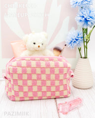 PAZIMIIK checkered makeup bag inside layout reveals single roomy compartment for essentials.