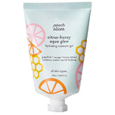 Peach Slices citrus-honey aqua glow bottle shows weightless hydration for daily use.