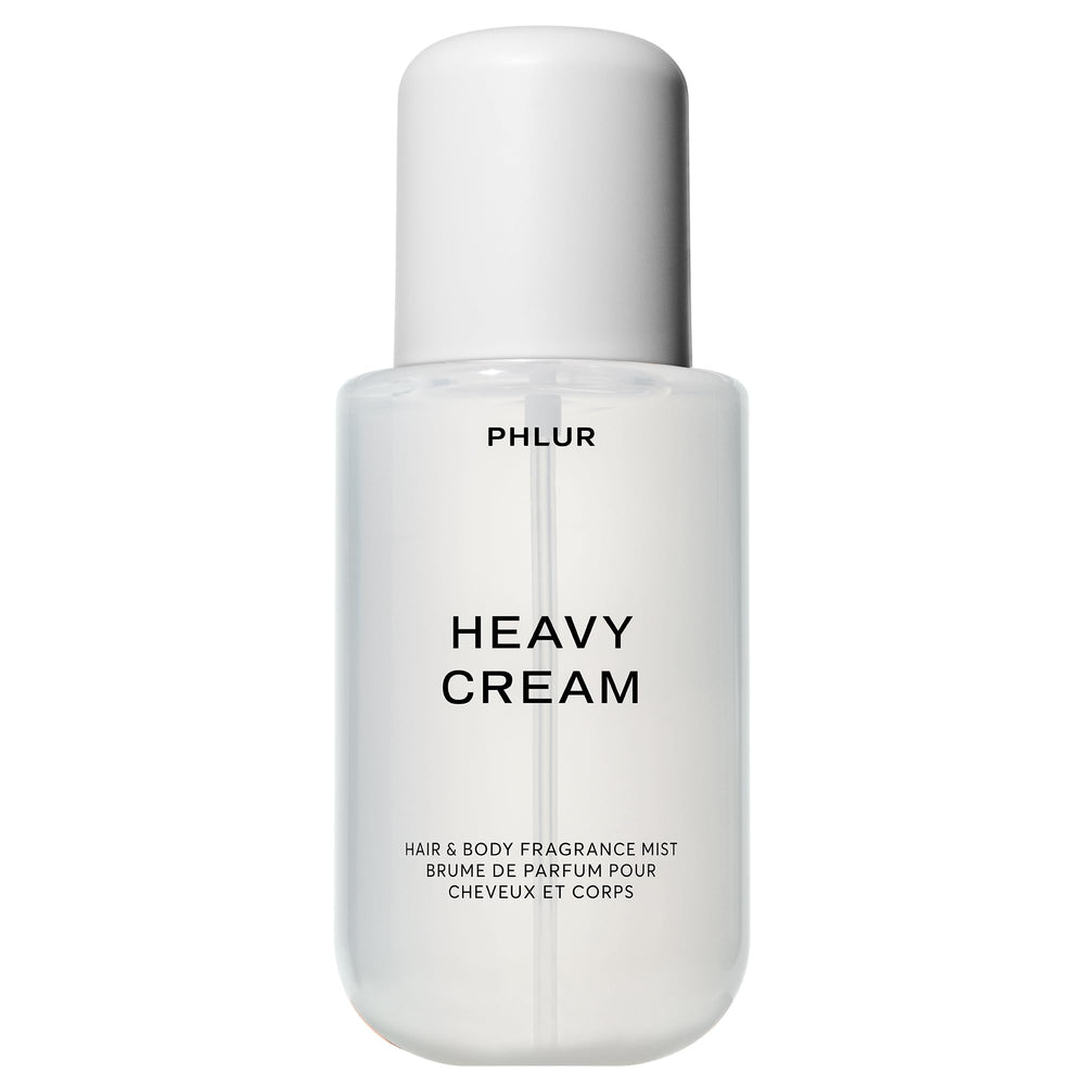 PHLUR Heavy Cream bottle close-up highlighting a creamy fragrance blend for all-day wear