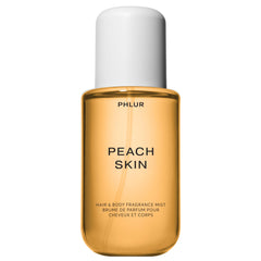 PHLUR Peach Skin Body Mist bottle pour highlights juicy sweetness for daily refreshment.