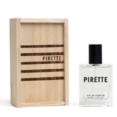 Pirette Eau de Parfum bottle close-up highlighting beachy coconut notes for daily wear