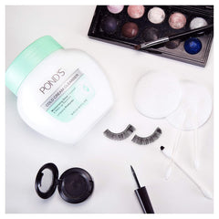 Pond's Cold Cream Cleanser purifying pores with a soothing touch.