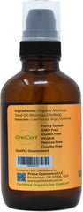 Prime Natural Moringa Oil close-up reveals rich oil ideal for nourishing skin and hair.
