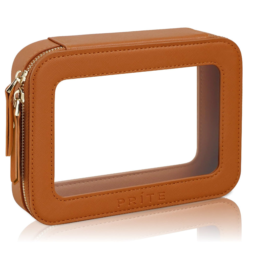 Prite clear makeup bag with golden zipper shows organized cosmetics for travel.