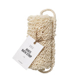 Public Goods exfoliating body scrubber close-up shows natural agave fibers for exfoliation.