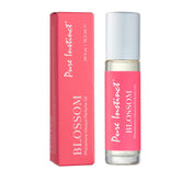 Pure Instinct BLOSSOM roll-on bottle close-up for portable, all-day fragrance.