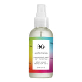 R+Co Mood Swing straightening spray bottle demonstrates heat-activated styling for smoother blowouts.