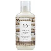 R+Co Ring Tone jar close-up reveals creamy gel texture for defined, frizz-free curls.