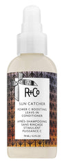 R+Co Sun Catcher Power C Leave-In bottle front promotes nourishing protection from environmental damage.