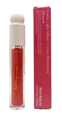 Rare Beauty Glimmer lip gloss application shows cushiony shine and hydrated glow.