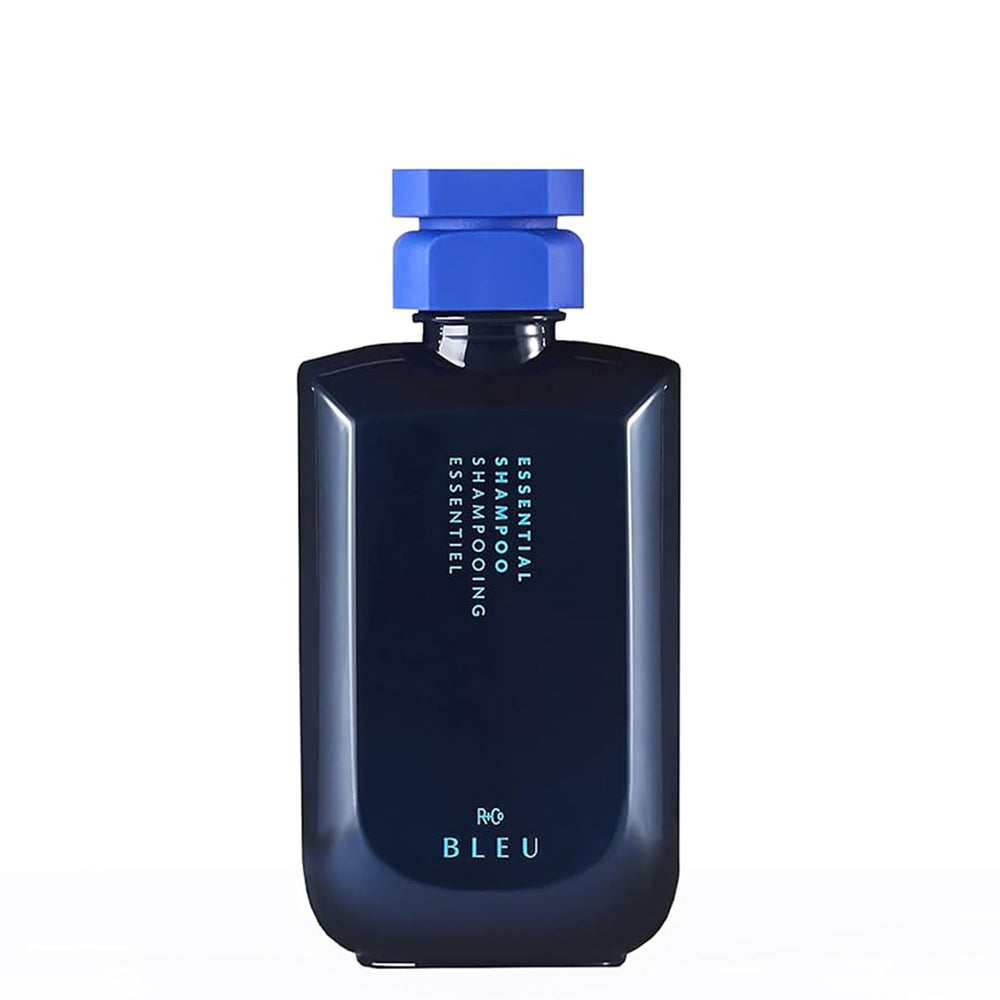 R+Co BLEU Essential Shampoo bottle closeup promoting gentle cleansing and hydration