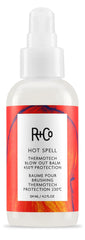 R+Co Hot Spell balm bottle displaying smoothing formula for frizz control